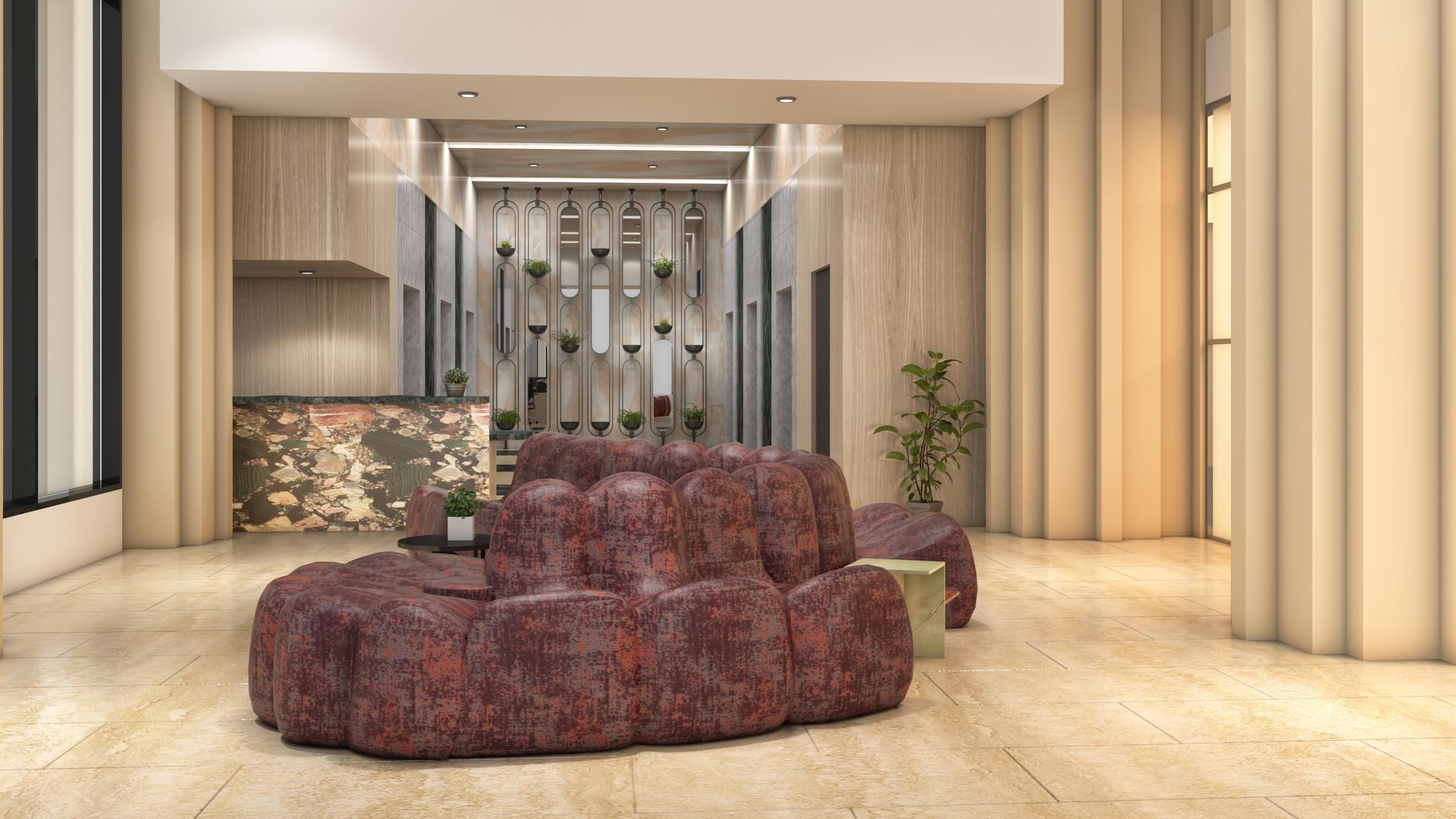 Landmark Tower Modern lobby with red sofas, a marble reception desk, vertical plant wall, and large windows.